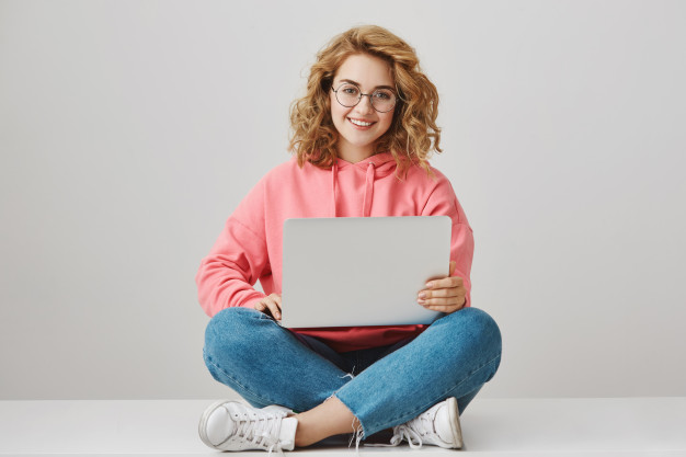 cute freelance girl using laptop sitting floor smiling 176420 20221
